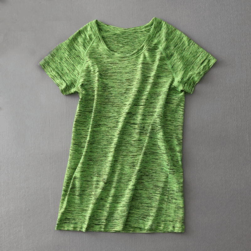 Green breathable women's short sleeve t-shirt for quick dry performance, ideal for yoga and running. Nylon polyester blend.